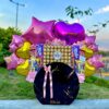 cesta con chocolates Ferrero, globos personalizados y dulces para regalo en Caracas