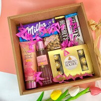 Caja abierta con splash, chocolates y decoración de regalo